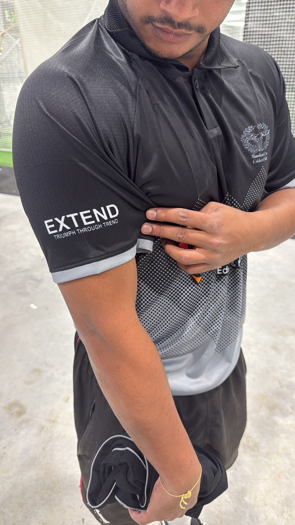 Premier Cricketer wearing Extend Sponsored Manukau City Senior Playing shirt.